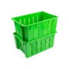 A stack of green plastic crates on top of each other.
