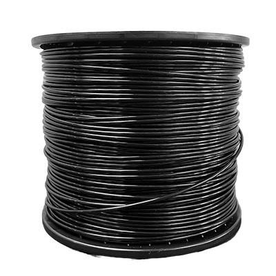 A spool of black wire is sitting on top of a white table.