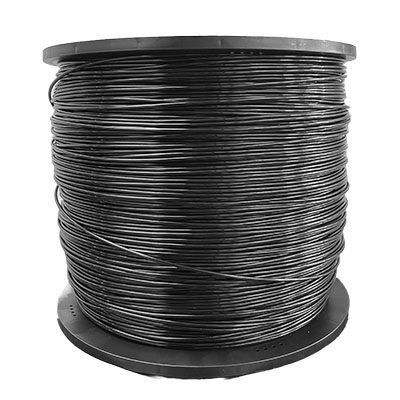 A spool of black wire sitting on top of a white table.