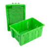 A green plastic crate with a lid on top of it.